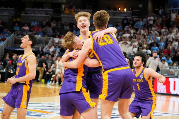 Scottsburg Warriors players celebrate after winning state against the South Bend St. Joseph Huskies on Saturday, March 30, 2024, during the IHSAA boys basketball Class 3A state championship game at Gainbridge Fieldhouse in Indianapolis. The Scottsburg Warriors defeated the South Bend St. Joseph Huskies 67-57. Joe Timmerman/IndyStar